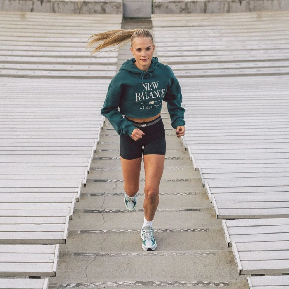 Parker Valby running up bleacher stairs 
